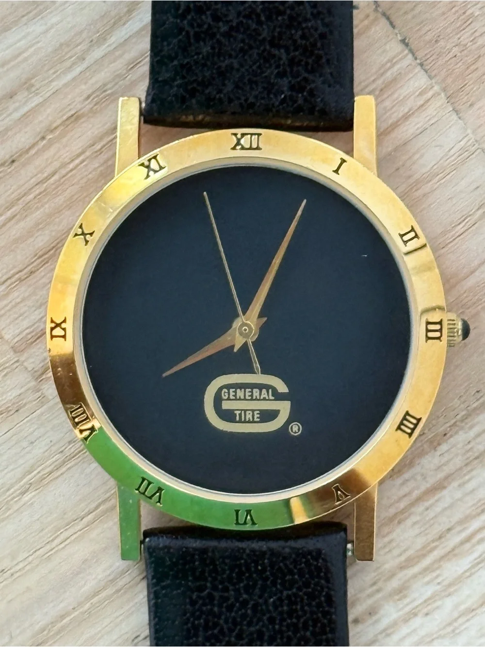 General Tire Dress Watch Black Dial Leather Strap Gold-Tone Case Hands